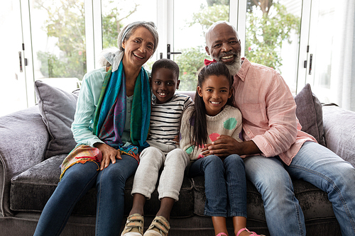 Portrait of African american Multi-generation family relaxing together on a sofa in living room at home