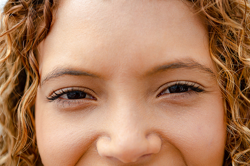 Close-up of happy mixed-race woman . Summer fun at home by the swimming pool