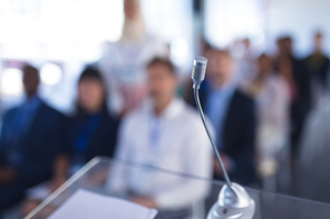 Close-up of microphone in business seminar at conference meeting. International diverse corporate business partnership concept