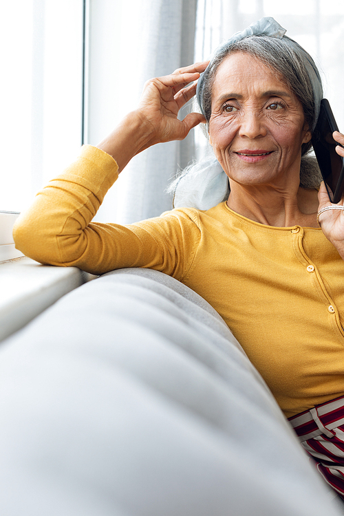 Front view of African American Woman talking on the phone. Authentic Senior Retired Life Concept