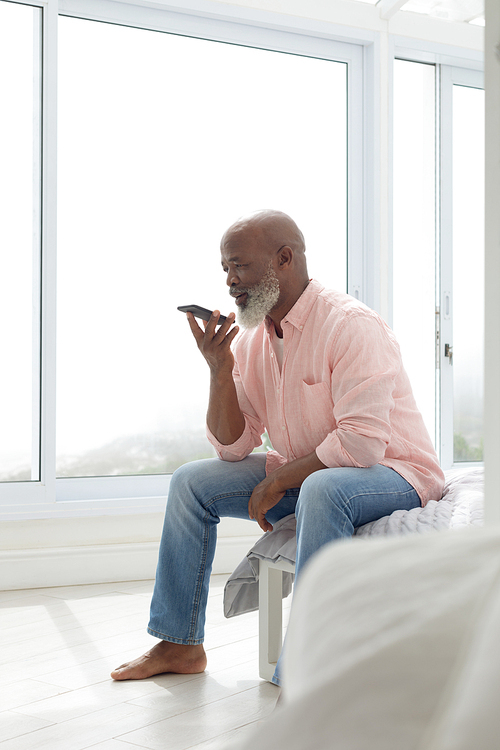 Side view of African American Man talking on the phone. Authentic Senior Retired Life Concept