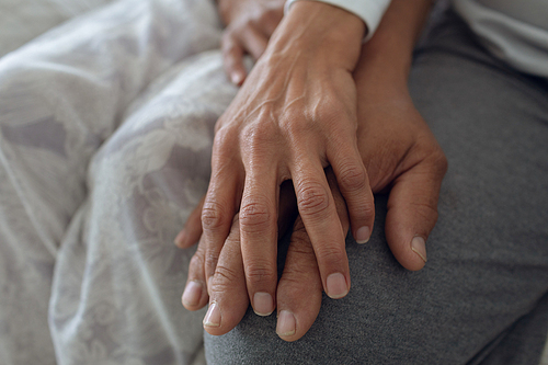 Close up of couple hands on top of each other. Authentic Senior Retired Life Concept