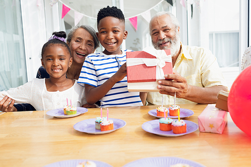 Portrait of African-American family smiling during a birthday party. Authentic Senior Retired Life Concept