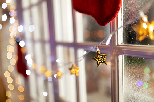 Close up of Christmas decoration of fairy lights in a window