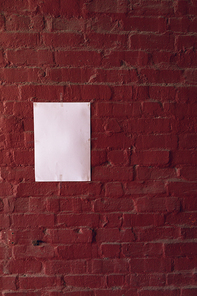 Close up of a blank sign hanging on a wall