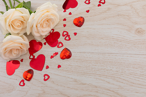 Bunch of white roses and red hearts lying on wooden background. romance valentine's day flower nature freshness copy space.