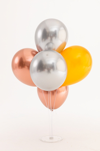 Silver, rose gold and gold metallic balloons on white background. happy birthday party celebration concept.