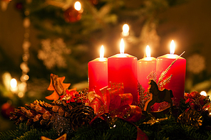 Advent wreath illuminated by candlelight