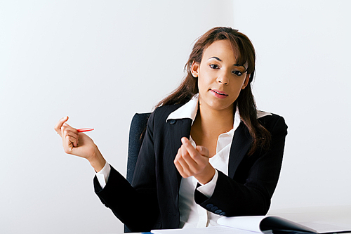 Female office worker gesturing