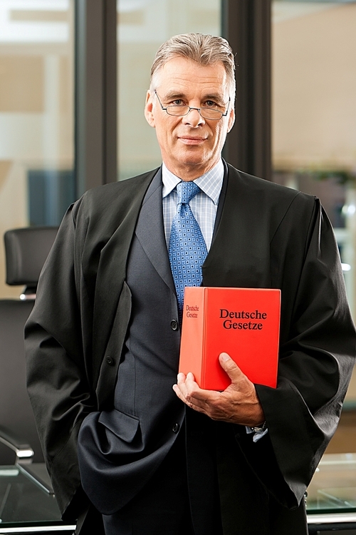 Lawyer with civil law code in a court room