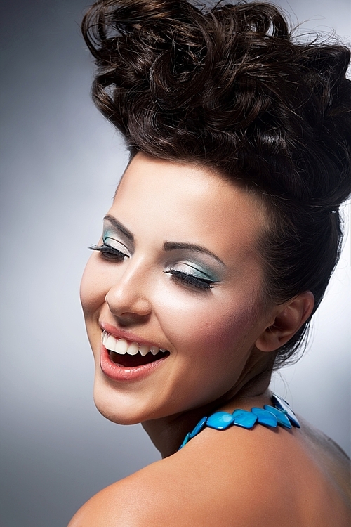 Delight. Elation. Beautiful young happy woman laughing with joy. Styling hairstyle. Shopping and discounts concept