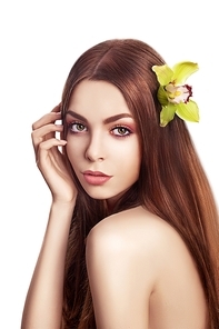 Beautiful Brunette Girl. Healthy Long Hair with Orchid Flower