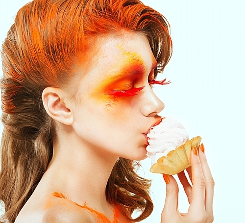 Coloring. Creativity. Profile of Red-haired Woman eating a Cake with Cream. Blush