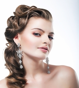 Delight. Elegant Posh Woman Bride with Diamond Earrings. Platinum Jewelry