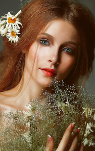 Pure Beauty. Auburn Girl holding Bouquet of Wildflowers. Tenderness