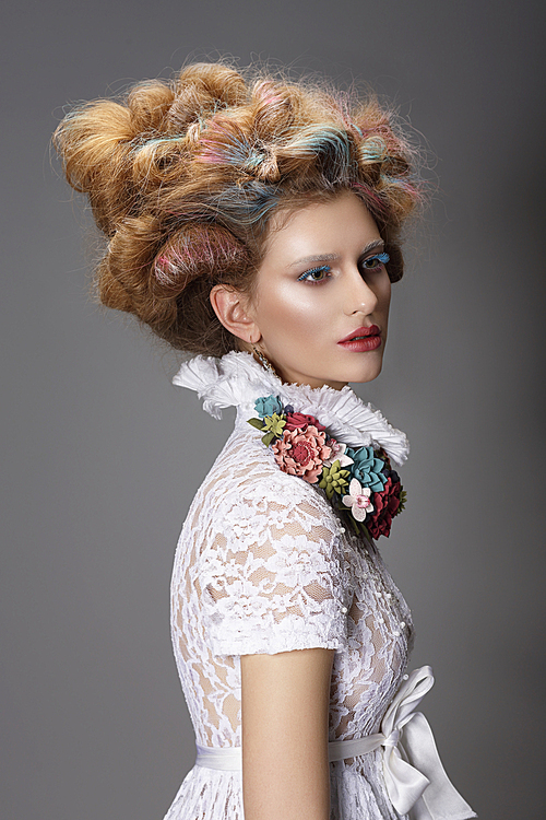 Updo. Dyed Hair. Woman with Modern Hairstyle. High Fashion