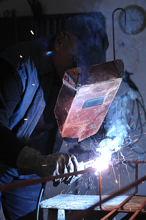 weld machine worker hard industry business