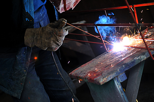 weld machine worker hard industry business