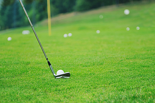 golf ball on sports golf course and hole