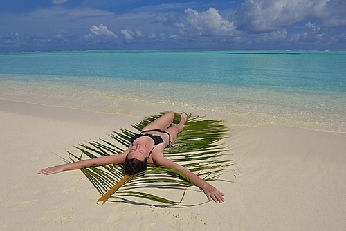 happy  woman on summer vacation on beautiful tropical beach have fun and relax