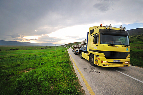 big truck drive on long country road