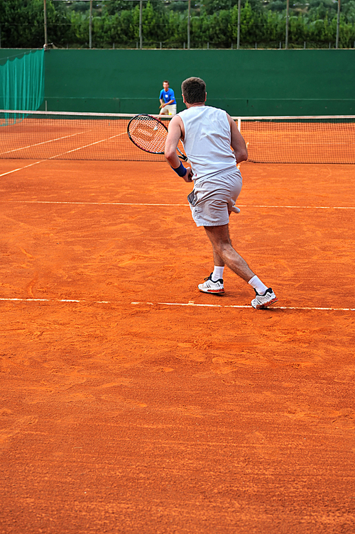 One man play tennis on outdoor court