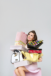 Brunette woman with heap of fashion accesories