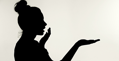 Silhouetthe of the surprised young woman