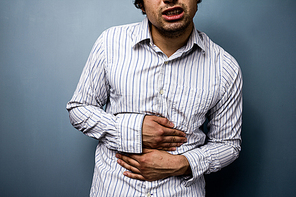 Multiracial man with stomach pains