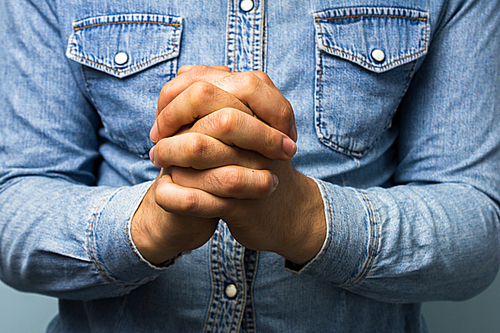 Man with hands in prayer