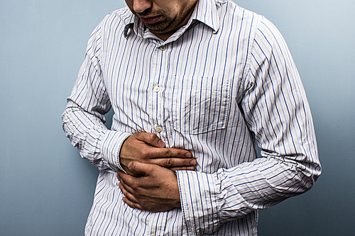 Young man with stomach pain