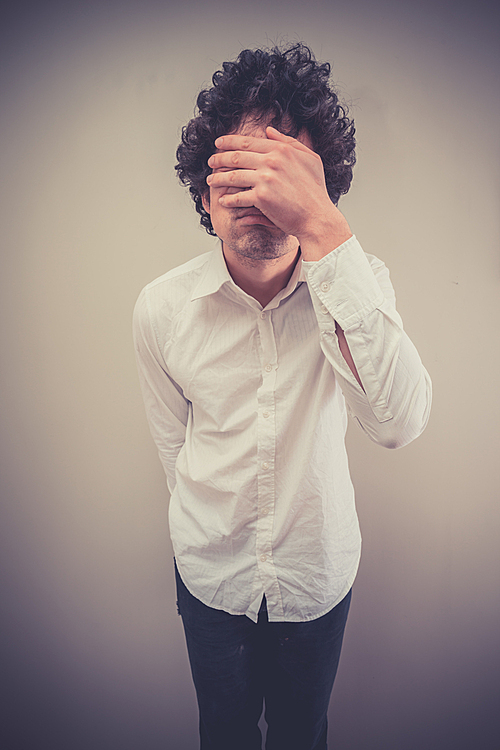 Young man is face palming