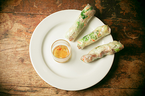 Summer rolls and fish sauce on a plate