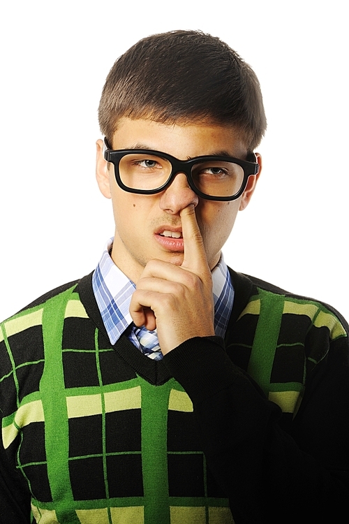 Young nerd student with finger in nose