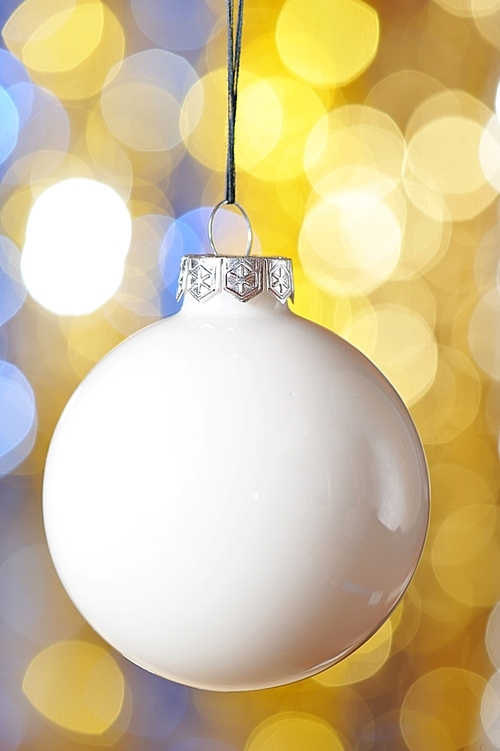 Christmas ball against defocused background with shallow depth of field
