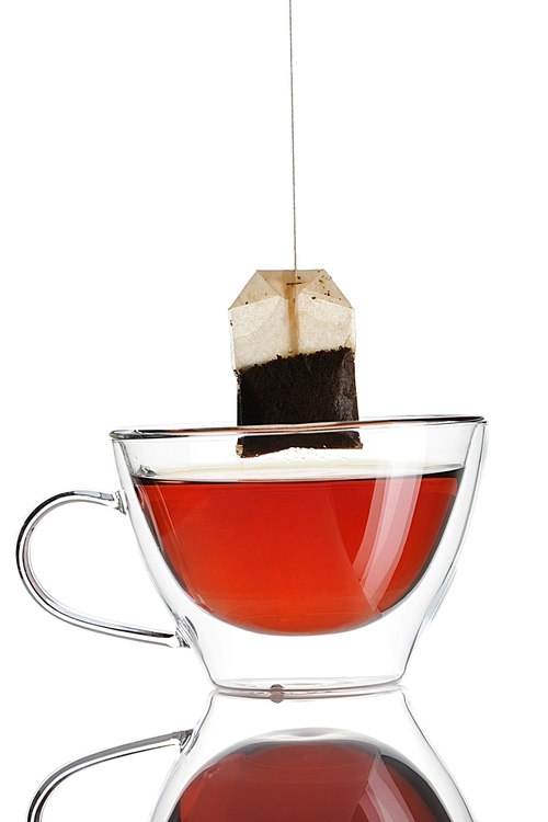 Teabag in the cup with hot water