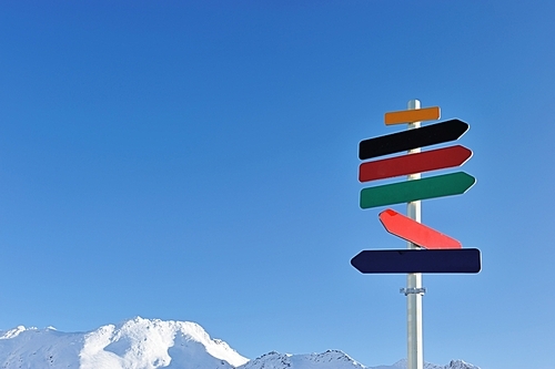 Arrow sign at mountains with snow in winter| Val-d'Isere| Alps| France
