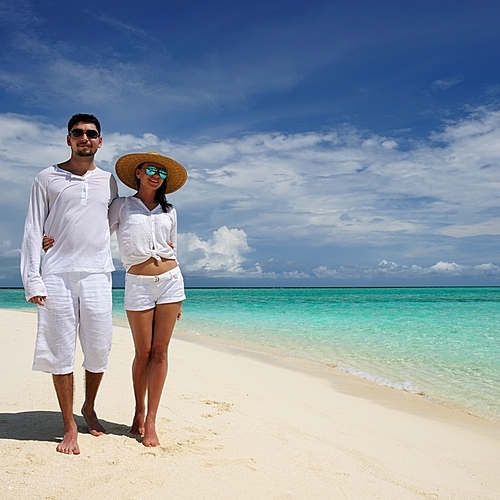 Couple on a tropical beach at Maldives