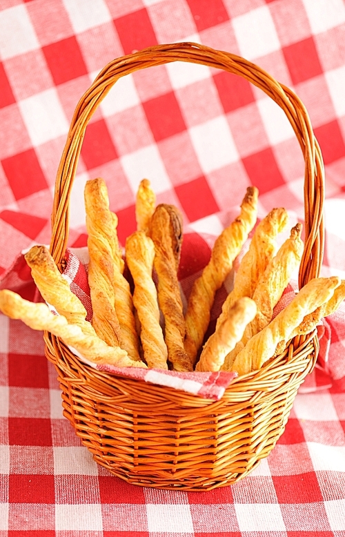 Cheese twists pastry over red cloth