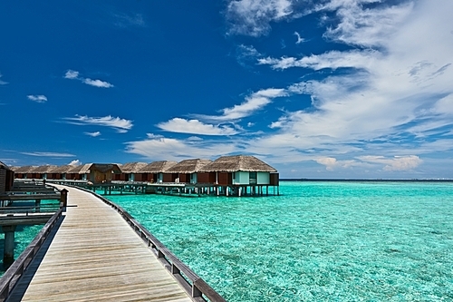 Beautiful beach with water bungalows at Maldives