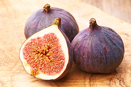 Fresh figs on rustic vintage wooden table