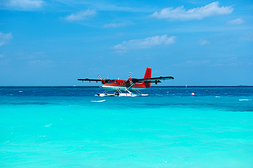 Twin otter red seaplane at Maldives