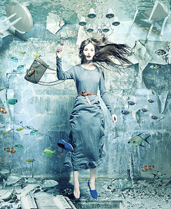 a pretty woman underwater in the flooded interior. creative concept