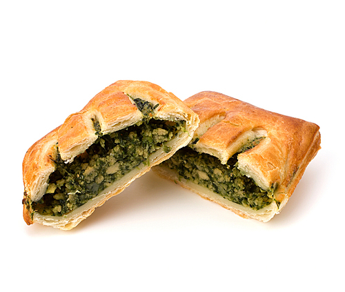 Puff pastry isolated on white. Healthy pasty with spinach.