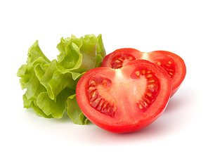 tomato vegetable and lettuce salad isolated on white