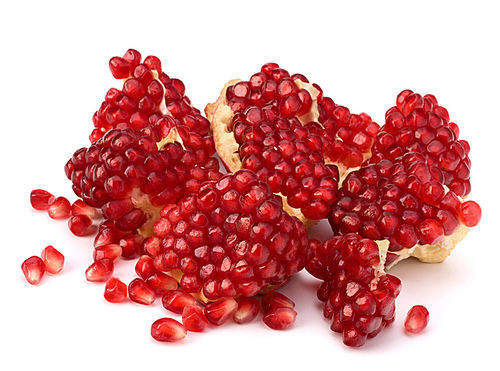 Ripe pomegranate piece  isolated on white