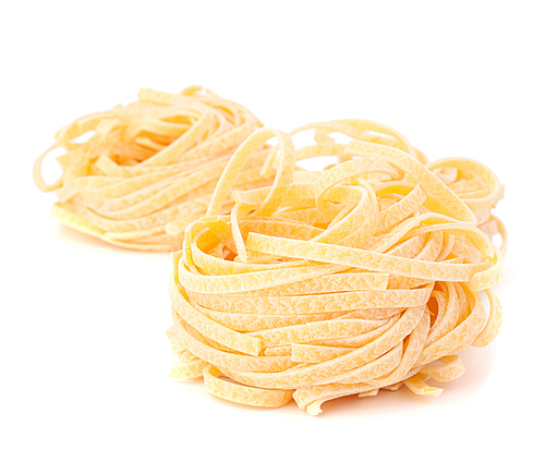 Italian pasta tagliatelle nest isolated on white