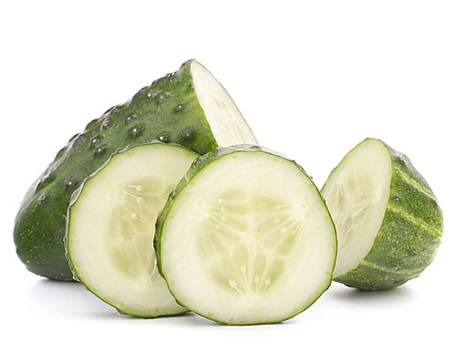 Sliced cucumber vegetable isolated on white cutout