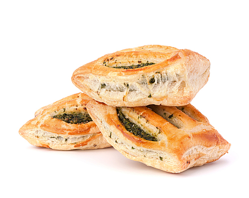 Puff pastry bun isolated on white. Healthy patty with spinach.