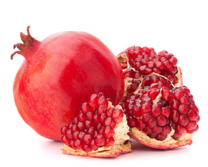 Ripe pomegranate fruit isolated on white cutout